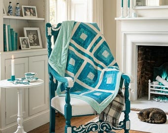 Log Cabin teal quilt  backed in cozy med thickness teal fleece. Hand tied to preserve softness. Lightweight but warm. Ships free!