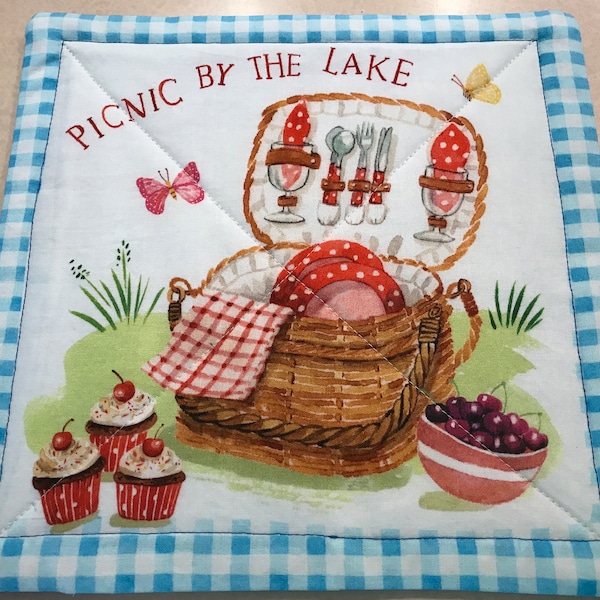 Casserole dish hot pad or snack mat 9.5 x 9.5 inches. Picnic by the Lake reversible to not all that wander are lost.