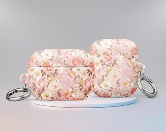 May include: Two pink floral patterned Airpod cases with a silver keychain attached to one case.