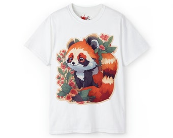 May include: White t-shirt featuring a cartoon red panda surrounded by flowers. The red panda has orange and white fur with a fluffy tail. The flowers are pink and red with green leaves. The shirt is made of a soft material.