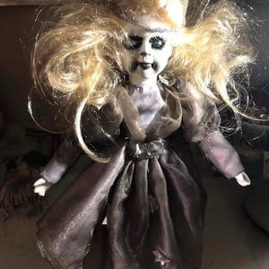 Creepy vintage wizard porcelain doll