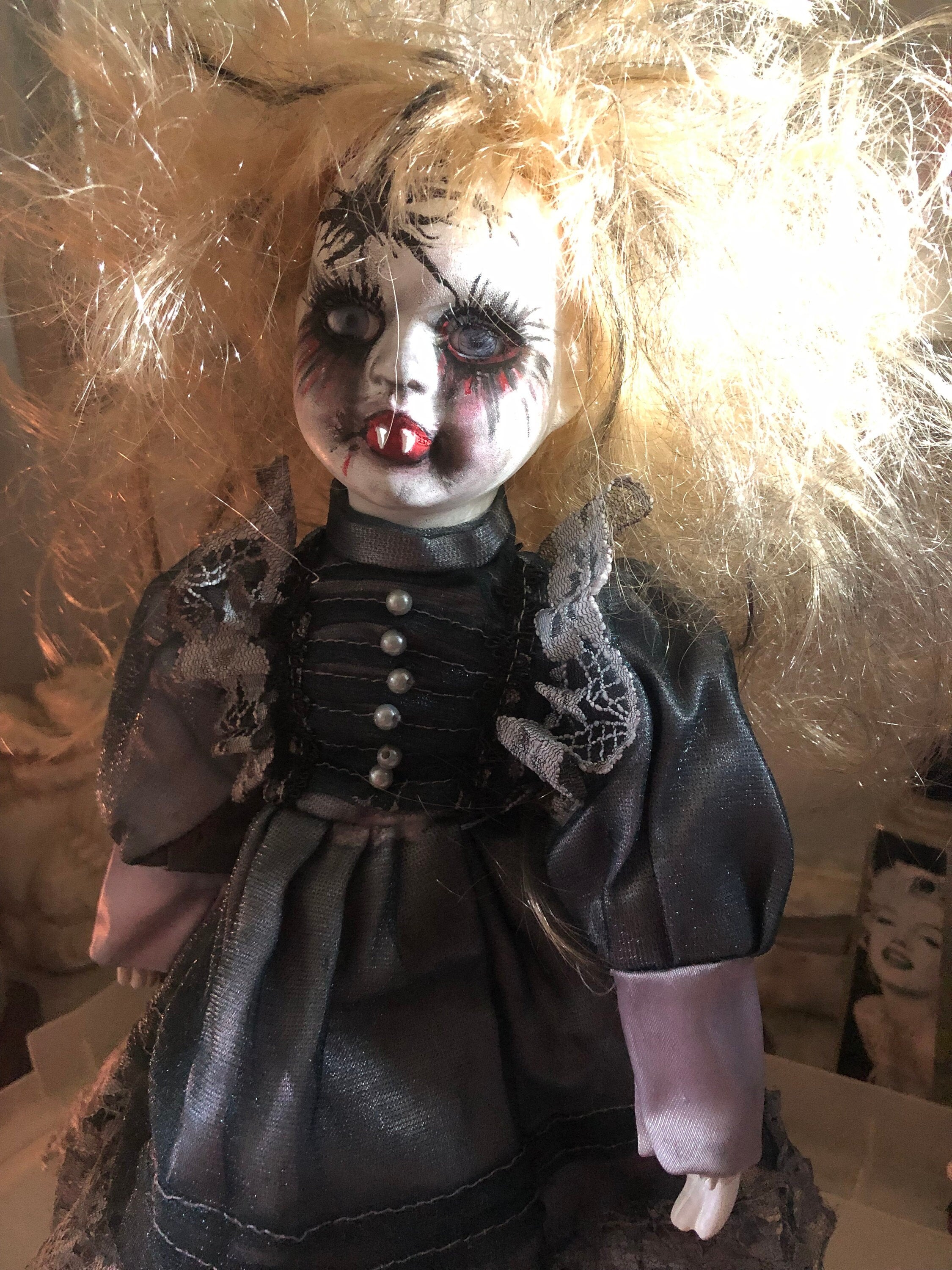 Creepy vampire porcelain doll