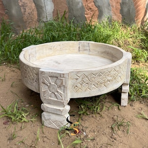 Distressed White Carved Wood Coffee Table: Round Mill Table