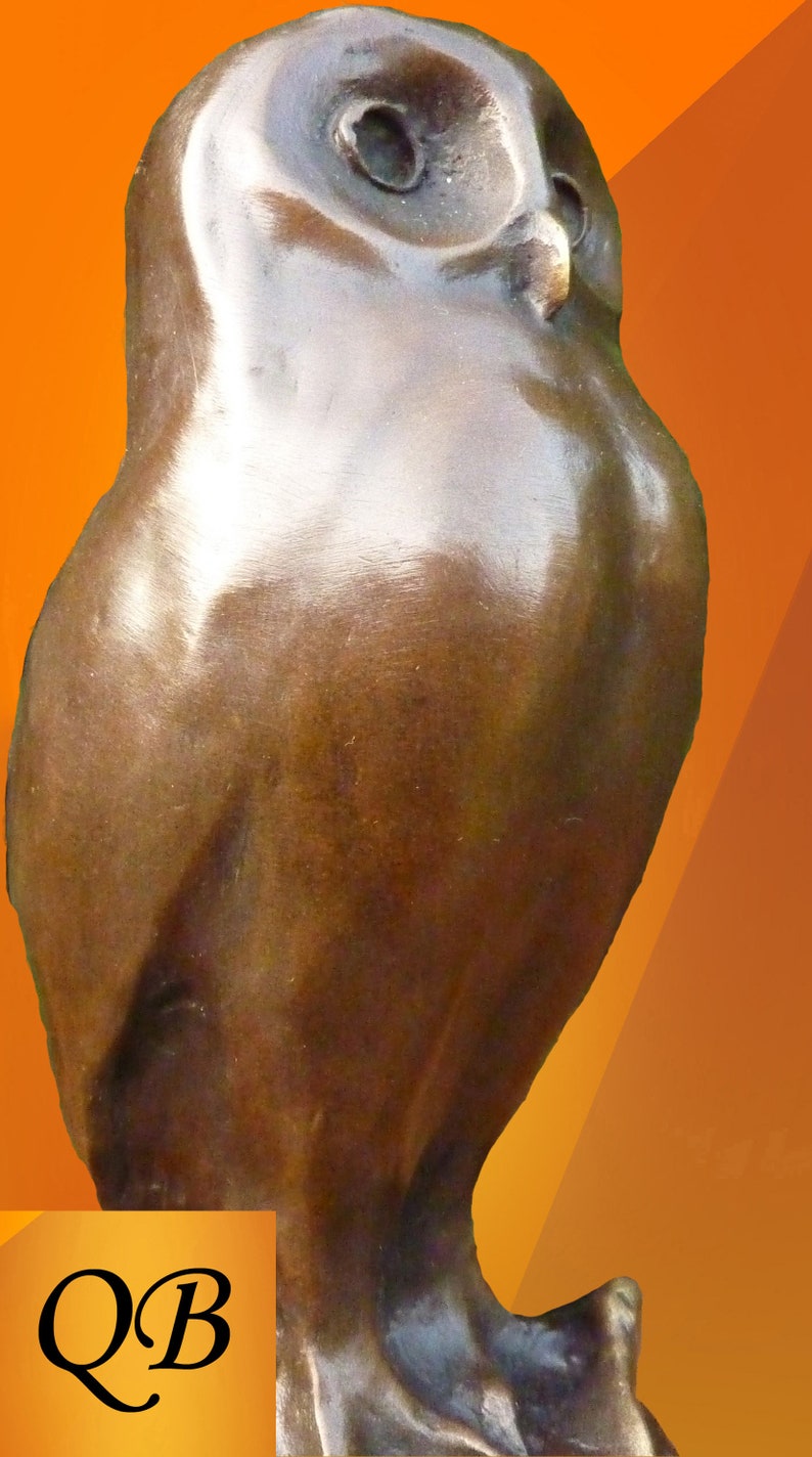 May include: A bronze owl sculpture with a smooth, reflective surface. The owl is depicted in a standing position, with detailed facial features and a rounded body. The background is a gradient of orange and yellow.