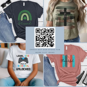 May include: Four different t-shirt designs with a QR code in the centre. The designs include a green rainbow with the word "Blessed" underneath, a green and brown cross with the word "faith" underneath, a white t-shirt with a video game controller and the text "Level 100 days of school unlocked", and a pink t-shirt with the word "Thankful" in colourful stripes.