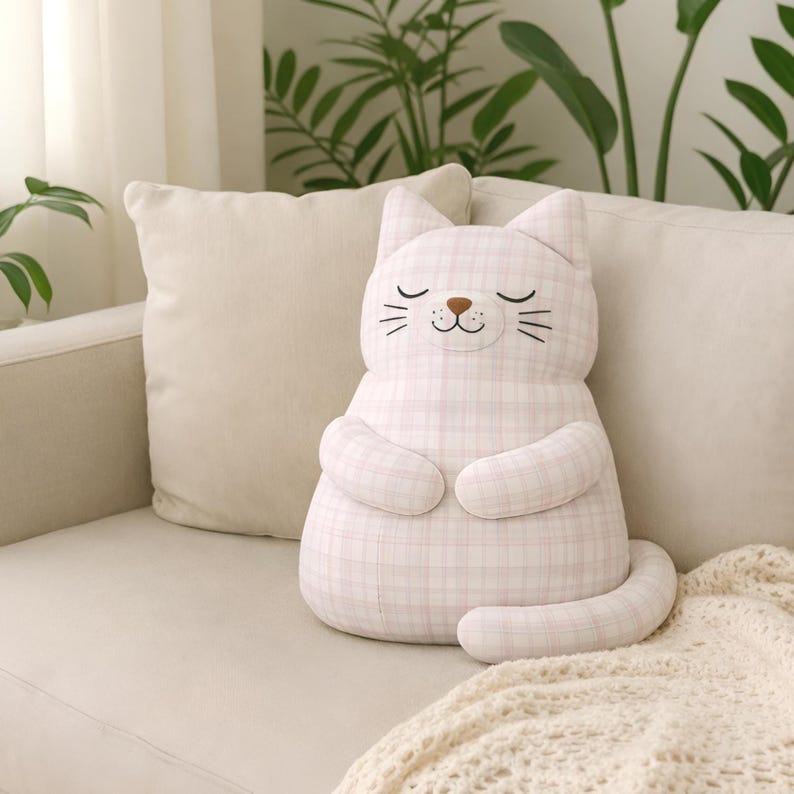 plush cat nursery decor, soft stuffed toy on sofa, cozy baby room
