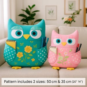 May include: Two owl-shaped storage organizers, one teal and one pink, with large eyes, yellow beaks, and polka-dot pockets. The teal owl has yellow flower details, and the pink owl has floral accents. The text at the bottom says "Pattern includes 2 sizes: 50 cm & 35 cm (20" 14")".