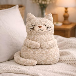 beige plush cat toy, soft stuffed animal, calm aesthetic nursery
