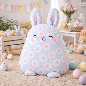 Blue bunny pillow with pastel circle print fabric in an Easter styled interior with eggs.