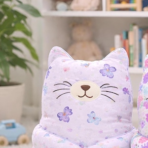 pastel plush cat toy, aesthetic nursery decor, soft stuffed animal