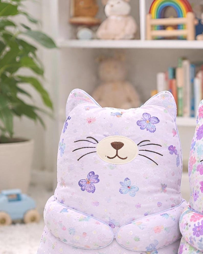 pastel plush cat toy, aesthetic nursery decor, soft stuffed animal