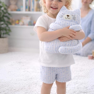 boy holding plush cat toy, soft stuffed animal for kids, handmade gift