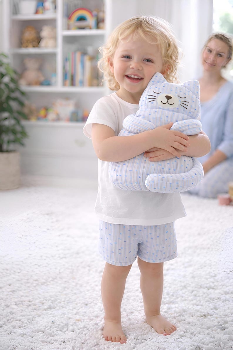 boy holding plush cat toy, soft stuffed animal for kids, handmade gift