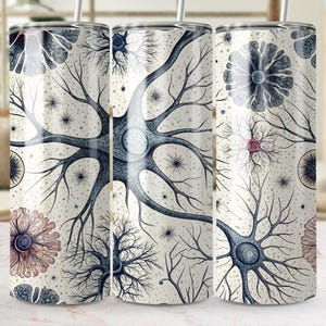May include: Three stainless steel tumblers with a white background and a black and blue illustration of a neuron. The illustration is repeated on each tumbler.