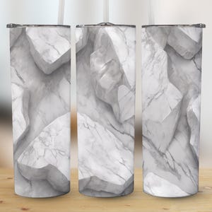 May include: Three stainless steel tumblers with a white marble pattern. The tumblers are all the same size and shape, and they have a white background with gray veins.