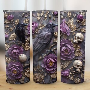 May include: Three stainless steel tumblers with a gothic floral design featuring black ravens, skulls, and purple flowers. The tumblers are perfect for everyday use or as a gift.