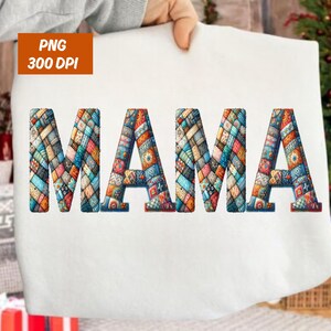 May include: A white sweatshirt featuring the word "MAMA" in large, colourful letters. The letters are filled with a patchwork design in shades of blue, orange, and green. The image also includes the text "PNG 300 DPI".