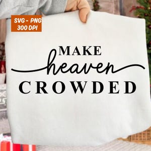 May include: White fabric with the phrase "MAKE heaven CROWDED" in black script and block letters. The image includes an orange square with the text "SVG - PNG 300 DPI".