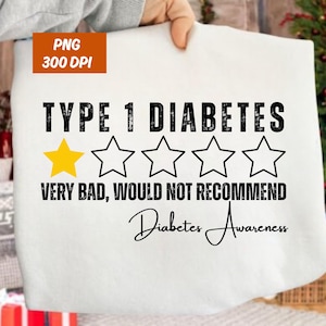 May include: White t-shirt with the text "TYPE 1 DIABETES" in black, a yellow star, and four outlined stars. Below, it reads "VERY BAD, WOULD NOT RECOMMEND" and "Diabetes Awareness" in script.