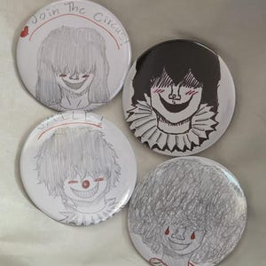 May include: Four white round buttons with hand-drawn illustrations of smiling characters. One button has the text "Join The Circus!" and a heart. The other buttons feature different characters with unique hairstyles and facial expressions. The drawings are in black and gray.