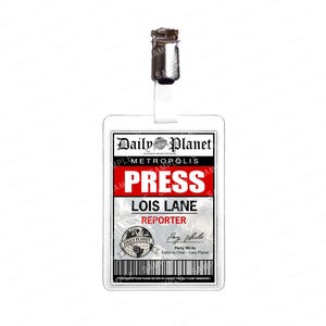 May include: A Daily Planet press pass featuring the name "Lois Lane" and the title "Reporter." The pass has a white background with the Daily Planet logo and the word "PRESS" in bold red letters. A metal clip and lanyard are attached.