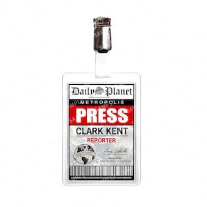 May include: A clear plastic Daily Planet press badge with a metal clip. The badge features the Daily Planet logo, the word "PRESS" in large red letters, and the name "CLARK KENT, REPORTER". The badge also includes the signature of Perry White.