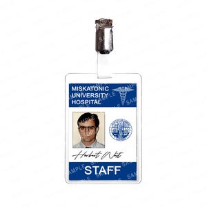 May include: A clear plastic staff ID badge with a metal clip. The badge features a photo, the name "Herbert West", and the text "MISKATONIC UNIVERSITY HOSPITAL STAFF". The badge has blue accents and a medical symbol.