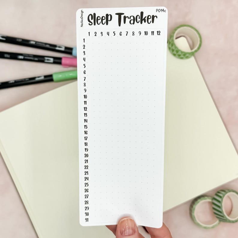 May include: A white printable sleep tracker with a black dotted grid and numbers 1 through 31 on the left side. The top of the tracker says "Sleep Tracker" in black text. The tracker is labeled "P014c" in the top right corner.