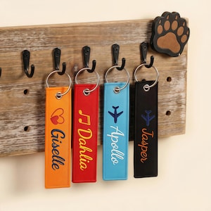 May include: A trio of ceramic mugs with a speckled, matte finish in cream, light grey, and dark grey. The mugs have a simple, minimalist design, suitable for coffee or tea.