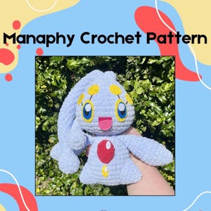May include: A light blue crochet plushie with a red gem and yellow accents. The plushie has large blue eyes, a pink tongue, and long, floppy ears. The text "Manaphy Crochet Pattern" is displayed at the top of the image.