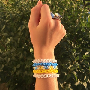 Blue, Yellow, and White Rubber band Braclet Set