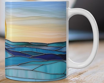 May include: White ceramic mug featuring a colourful stained glass design of a sunset over the ocean. The design incorporates blue, green and yellow shades.