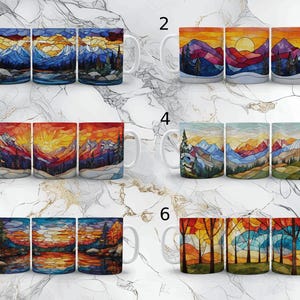 May include: Six different designs of ceramic mugs featuring stained glass style images of mountains, trees, and sunsets. The mugs are white with a handle on the right side.