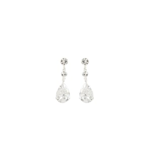 May include: A pair of silver-toned drop earrings. Each earring features a small, round crystal at the top, followed by a smaller crystal, and a large, pear-shaped crystal at the bottom. The crystals are clear and sparkling.