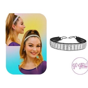 Op de afbeelding: Een zwart hoofdband met een rij heldere strass steentjes. Het hoofdband is op een witte achtergrond met de tekst "GO GIRL!" in roze.