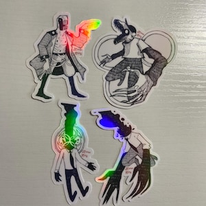 May include: Four holographic stickers featuring unique character designs. The stickers include a figure in a long coat, a creature with a bird-like mask, and two figures in suits. Each sticker has a black and white illustration with holographic accents.