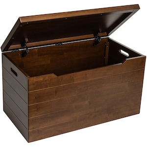 May include: A dark brown wooden toy chest with a hinged lid. The lid is open and the inside of the chest is visible.