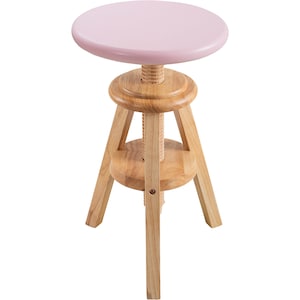 May include: A light pink adjustable stool with a round seat. The stool has a wooden base with three legs and a central threaded rod for height adjustment. The seat is approximately 30 cm in diameter.