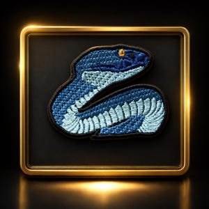 May include: An embroidered patch featuring a coiled snake in shades of dark blue and light blue, with a single yellow eye. The patch has a black border and is displayed within a square, metallic gold frame against a dark background.