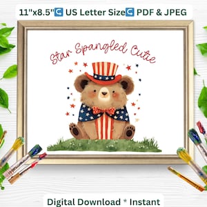 May include: A framed print featuring a watercolor illustration of a bear dressed in patriotic attire. The bear wears a hat and cape in red, white, and blue, with the text "Star Spangled Cutie." The print measures 11" x 8.5".
