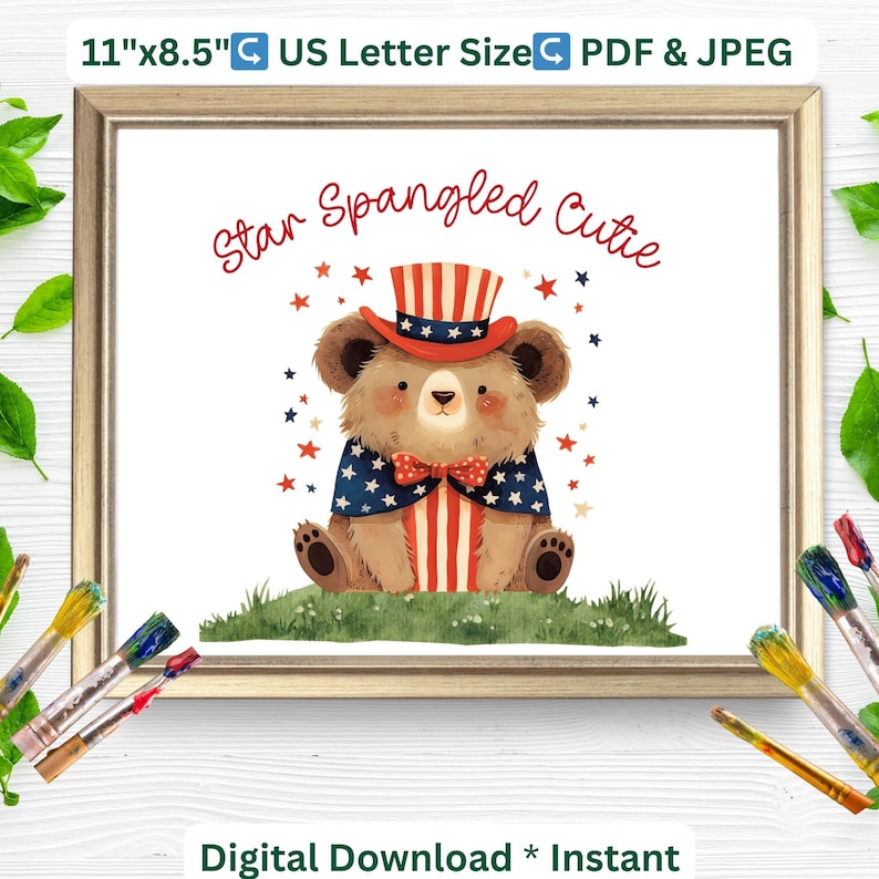 May include: A framed print featuring a watercolor illustration of a bear dressed in patriotic attire. The bear wears a hat and cape in red, white, and blue, with the text "Star Spangled Cutie." The print measures 11" x 8.5".