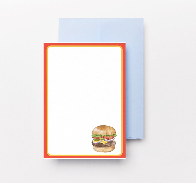 May include: A red and yellow lined card with a watercolour illustration of a hamburger. The hamburger has a sesame seed bun, lettuce, tomato, onion, and a cheese slice.