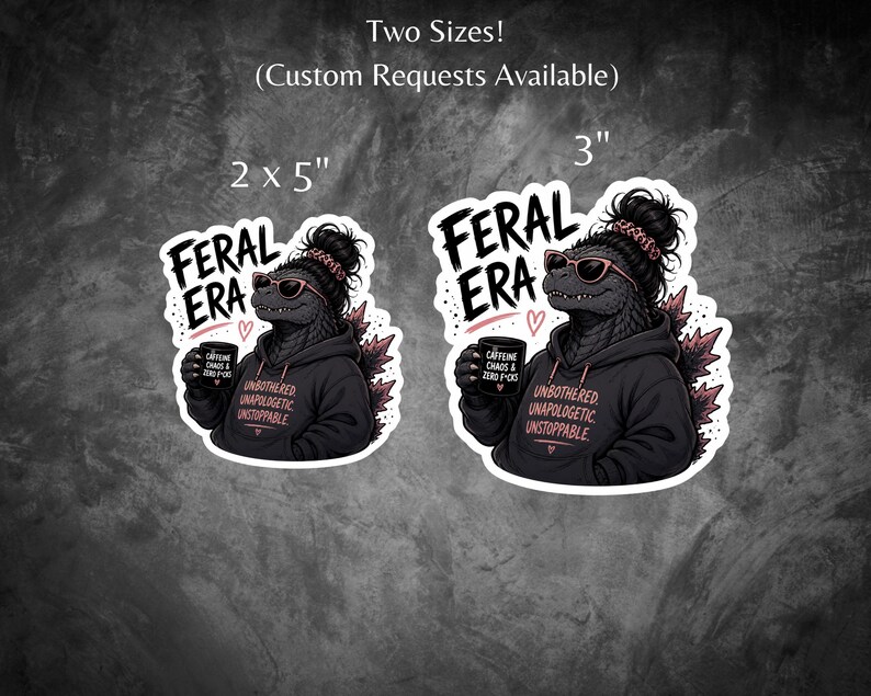 Op de afbeelding: Twee stickers met een Godzilla-achtig wezen met een zonnebril en een hoodie, met een koffiemok. De stickers lezen "FERAL ERA" en "UNBOTHERED UNAPOLOGETIC UNSTOPPABLE". Verkrijgbaar in 5.08 cm x 12.7 cm en 7.62 cm.