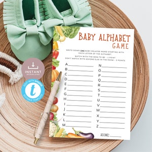 May include: Printable baby shower game card with a colorful vegetable border. The card has the title "Baby Alphabet Game" and instructions to write down one baby-related word for each letter of the alphabet.  The game includes a score section.