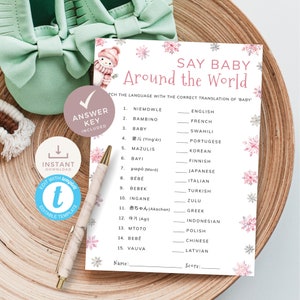 Puede incluir: Un juego de baby shower imprimible con un diseño de copo de nieve rosa y blanco. El juego se llama "Say Baby Around the World" y pide a los jugadores que coincidan con la traducción correcta de la palabra "bebé" en diferentes idiomas.