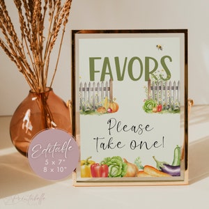 May include: A printable sign with a gold frame and a green background. The sign says "FAVORS" in green text and "Please Take One!" in black text. The sign is decorated with a watercolor illustration of a garden fence, flowers, and vegetables. The sign is available in two sizes: 5 x 7 inches and 8 x 10 inches.