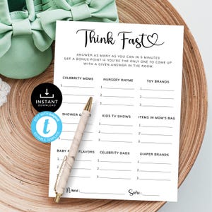 May include: A printable baby shower game called "Think Fast" with a heart symbol. The game has categories like "Celebrity Moms", "Nursery Rhymes", "Toy Brands", "Shower Gifts", "Kids TV Shows", "Items in Mom's Bag", "Baby Food Flavors", "Celebrity Dads", and "Diaper Brands".