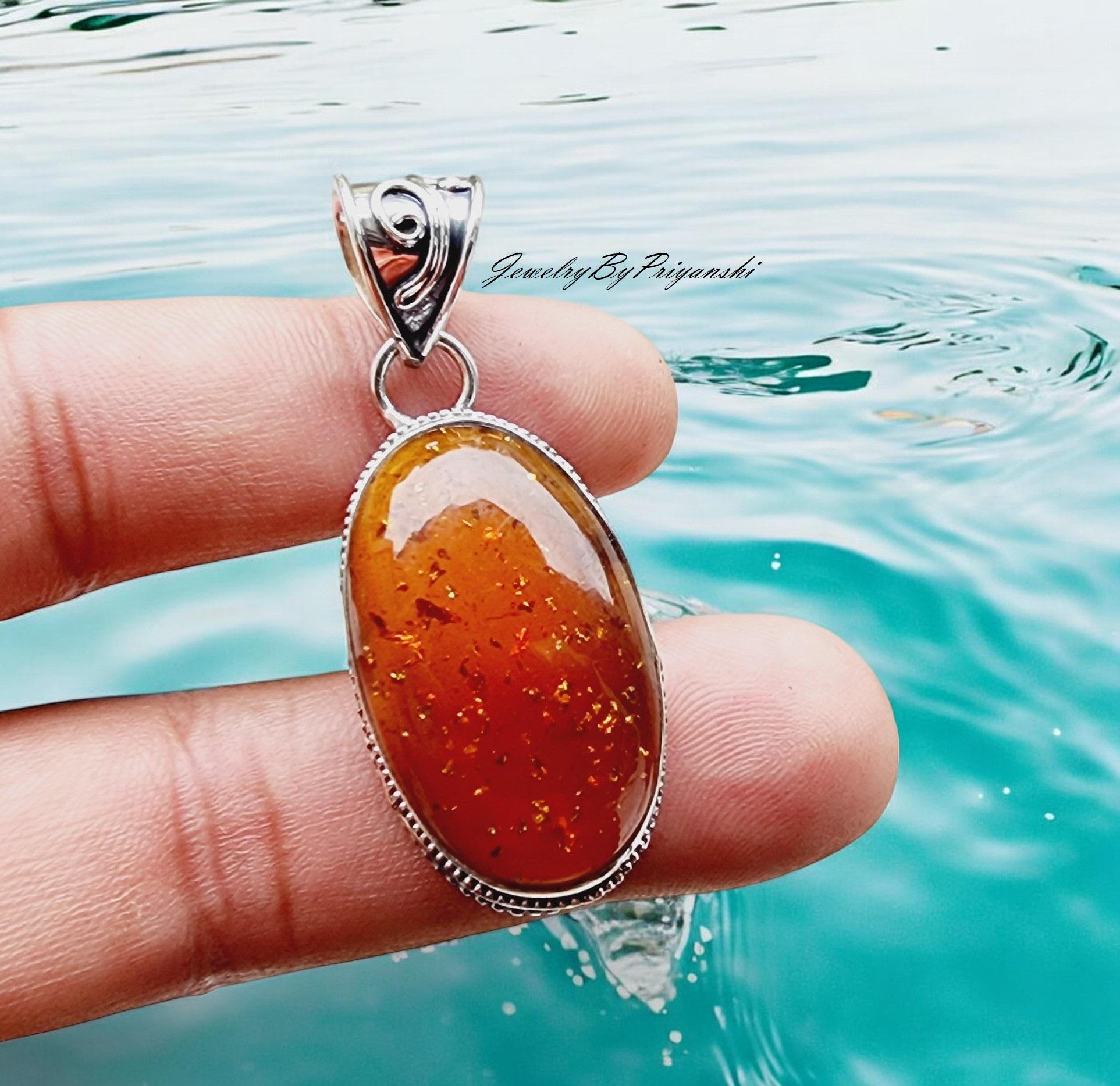 Artisana-Schmuck Ciondolo in ambra scoiattolo, incastonato in argento sterling 925/000