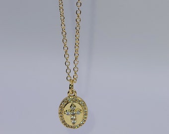 Gold necklace with oval cross pendant made for men women and kids. religious gold cross