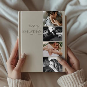 May include: A cream-coloured photo album with the names "JASMINE and JOHNATHAN" and the date "3RD JUNE 2023" printed on the cover. The album features four black and white photographs of a couple. The album is held by a person.